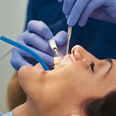Patient smiling during dental cleaning