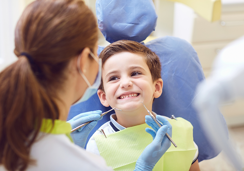 Little boy in dental chair for dental checkup