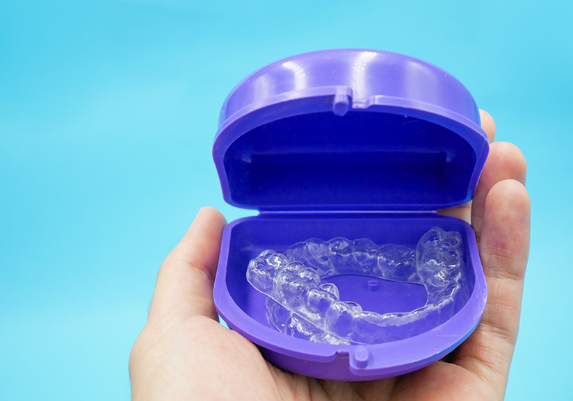 Holding clear aligners in blue case