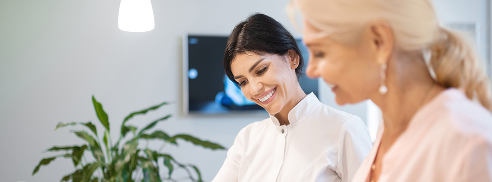 Two women looking down at a form