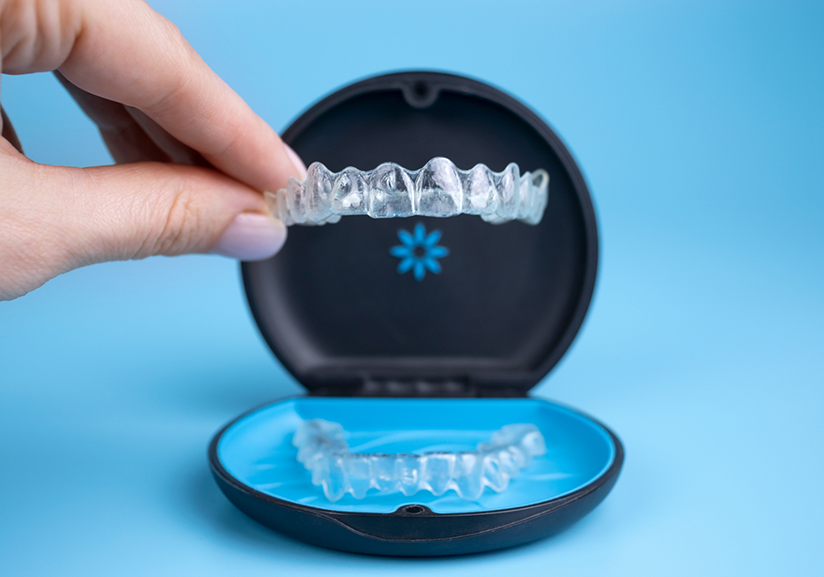 Taking clear aligner out of a case