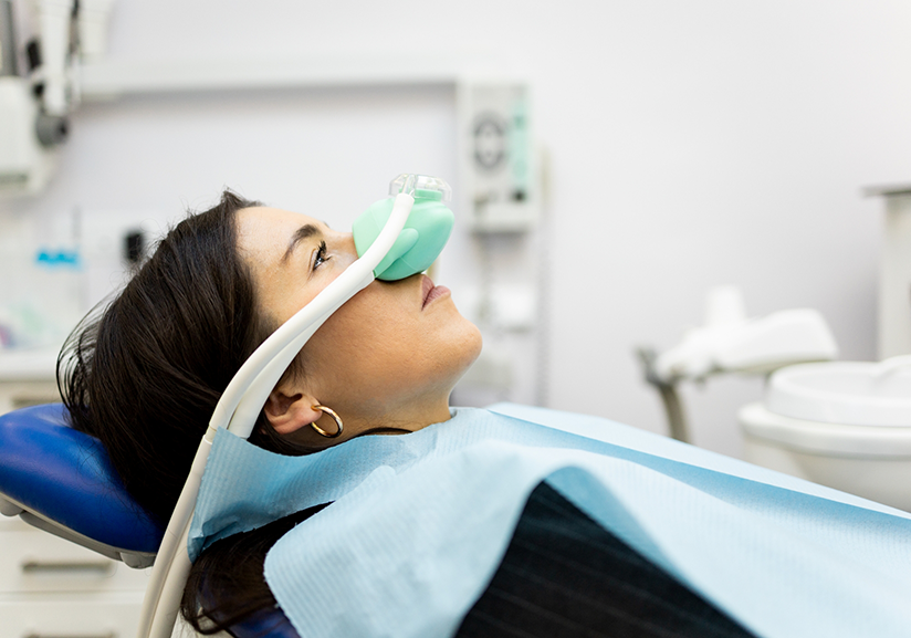 Little boy in dental chair with mask for nitrous oxide sedation