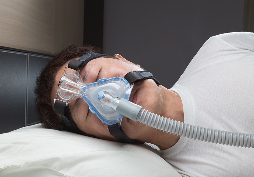 Man sleeping on side with CPAP