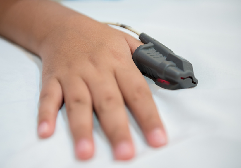 Hand with sensor on finger for sleep test